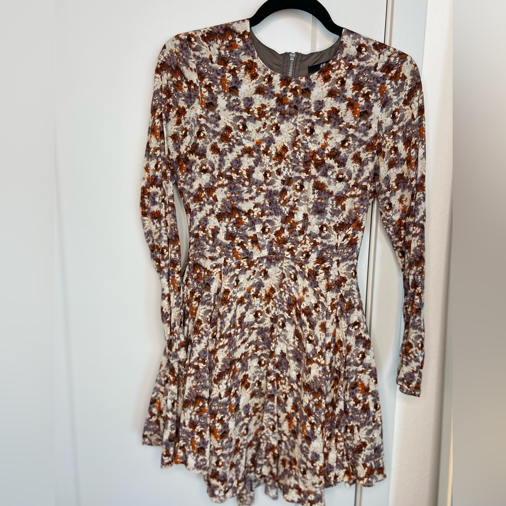 Long Sleeve Patterned Dress with ruffled skirt & exposed back zipper